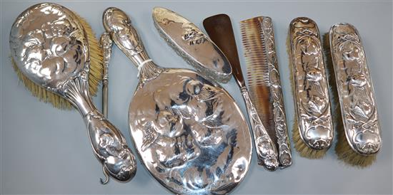 An early 20th century seven piece silver mirror and brush set by William Comyns, London, 1906/7/9 and one other items.